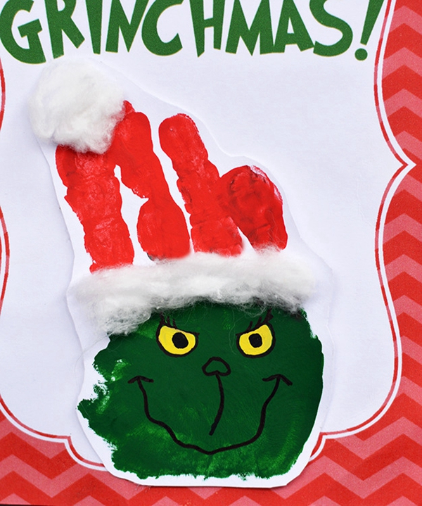Christmas card featuring a Grinch handprint