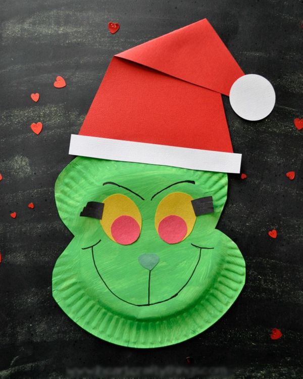 Child's Grinch craft made from a paper plate