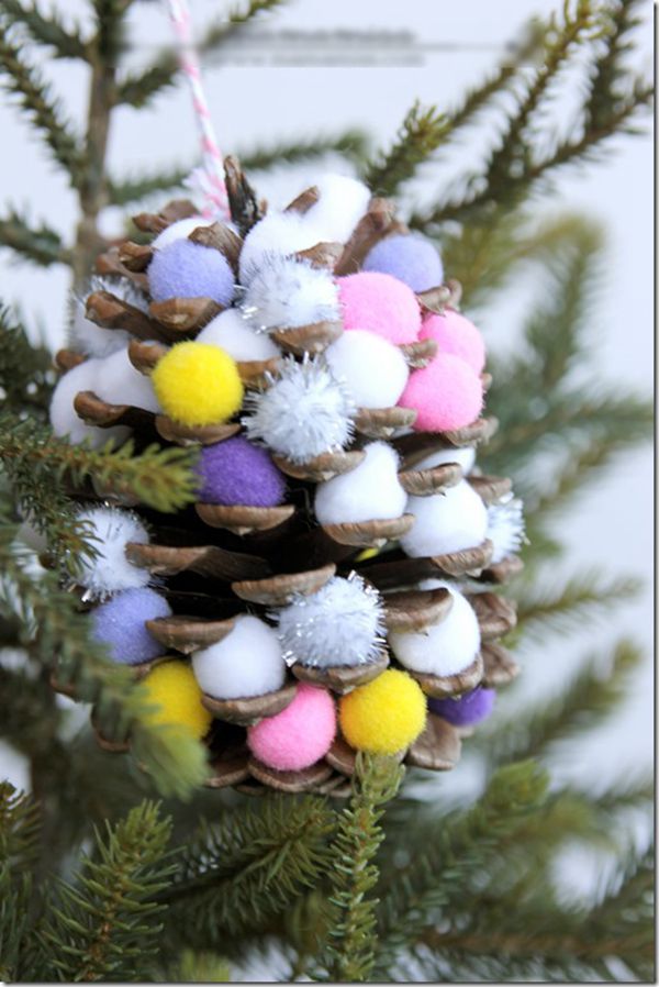 Pine cone ornament decorated with pom-poms
