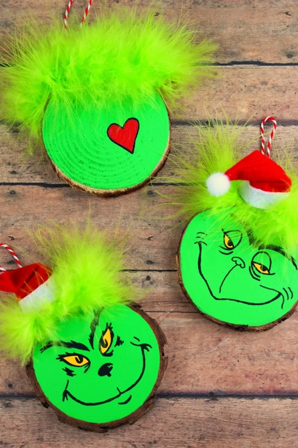 Grinch ornaments made from wood slices